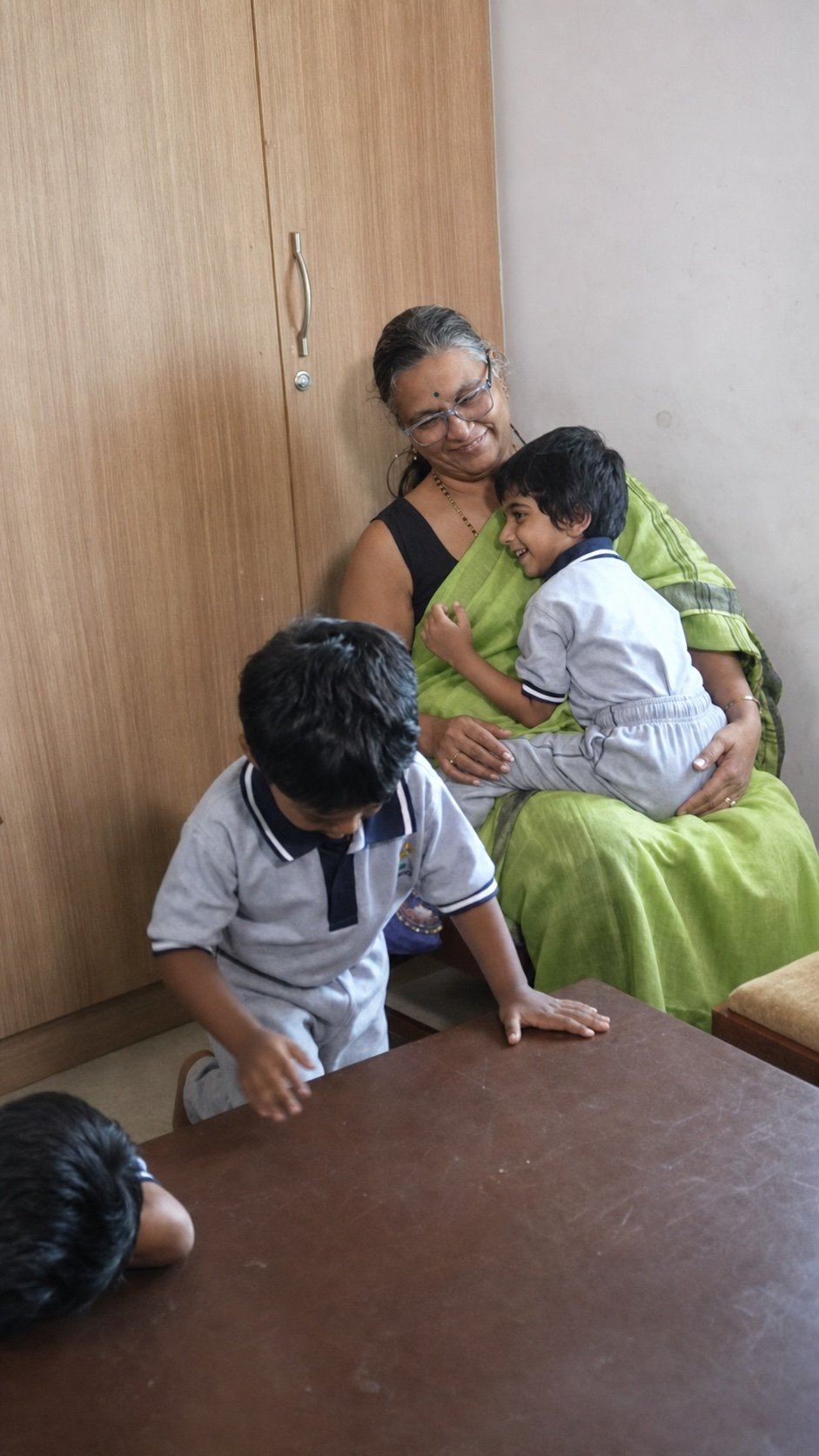 An Arka child returning to a familiar educator