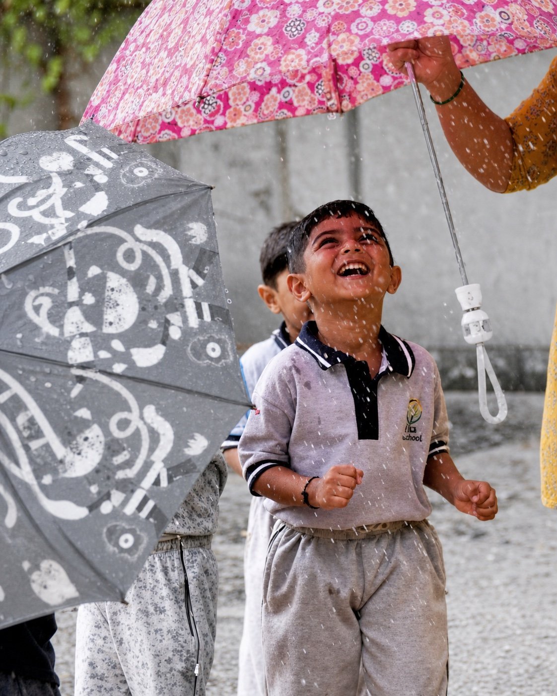 Arka child feeling raindrops outdoors