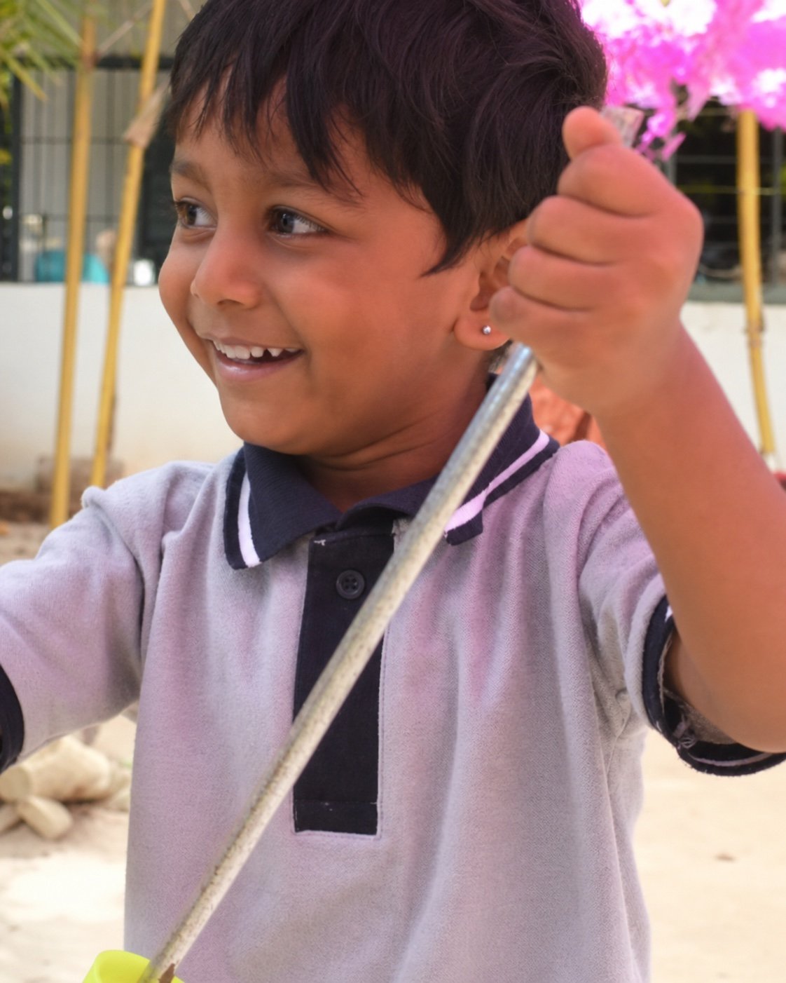 Arka child smiling during a garden activity