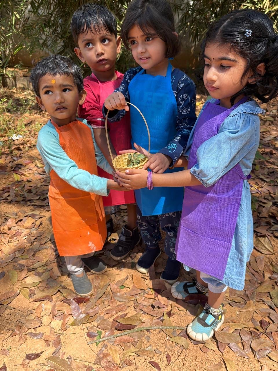 Children sharing a nature discovery in the garden